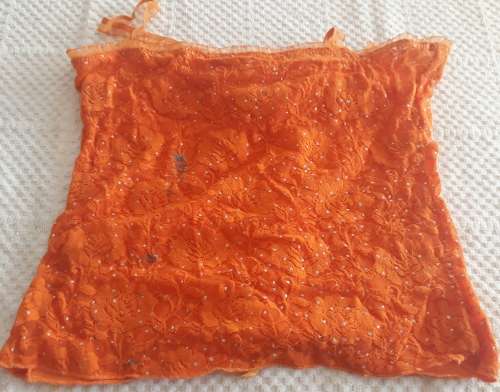 LADIES ORANGE TOP WITH A FEW MARKS ON IT