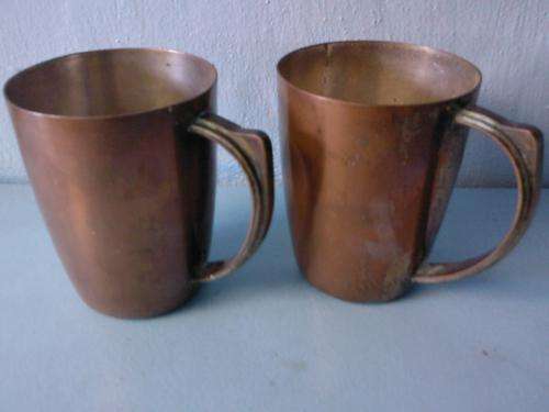 A PERFECT PAIR OF COPPER MUGS