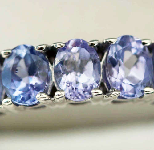 TANZANITE HALF ETERNITY RING IN '925' STERLING SILVER RING. DEEP LILAC COLOUR.