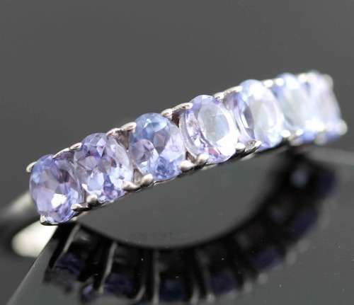 TANZANITE HALF ETERNITY RING IN '925' STERLING SILVER RING. DEEP LILAC COLOUR.