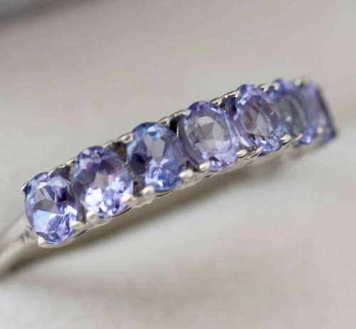 TANZANITE HALF ETERNITY RING IN '925' STERLING SILVER RING. DEEP LILAC COLOUR.