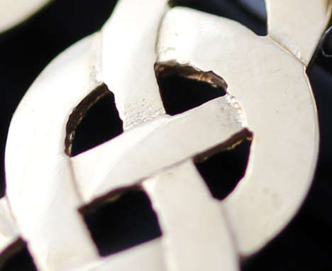 DAINTY UNUSUAL 9CT YELLOW GOLD EARRINGS. CLASSIC CELTIC KNOT DESIGN. VINTAGE PIECE BOUGHT IN ENGLAND