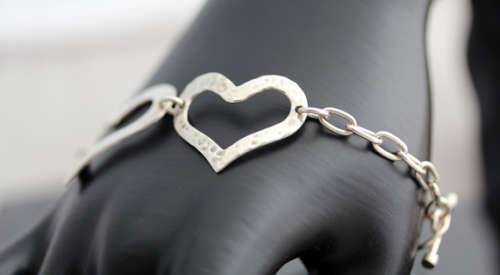 FUNKY VINTAGE STERLING SILVER HEART DESIGN BRACELET WITH TOGGLE CLOSURE. 925