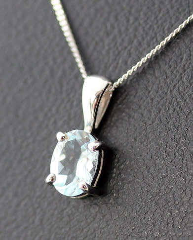 DELICATE ICE BLUE AQUAMARINE 9CT WHITE GOLD PENDANT AND CHAIN. 375