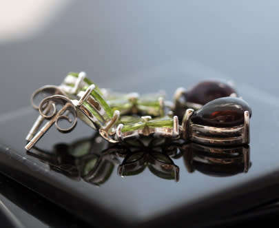 GORGEOUS REAL PERIDOT FLORAL EARRINGS WITH PEAR-CUT BLACK OPAL DROPS IN STERLING SILVER.