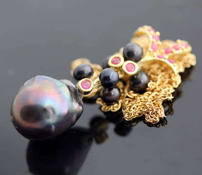 BLACK TAHITIAN BAROQUE PEARL AND NATURAL RUBY GOLD-HUED STERLING SILVER PENDANT ROPE CHAIN