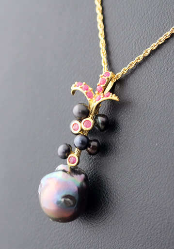 BLACK TAHITIAN BAROQUE PEARL AND NATURAL RUBY GOLD-HUED STERLING SILVER PENDANT ROPE CHAIN