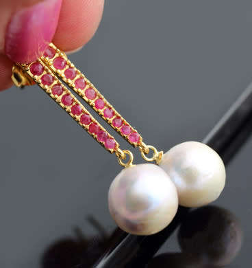 LONG DRAMATIC DROP & DANGLE EARRINGS WITH BAROQUE PEARLS & RUBIES IN GOLD-HUED STERLING SILVER. 925