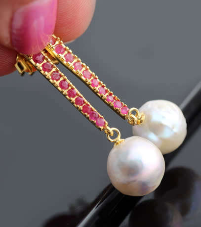 LONG DRAMATIC DROP & DANGLE EARRINGS WITH BAROQUE PEARLS & RUBIES IN GOLD-HUED STERLING SILVER. 925