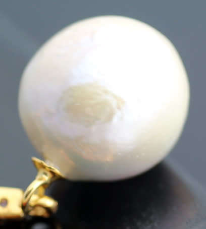 LONG DRAMATIC DROP & DANGLE EARRINGS WITH BAROQUE PEARLS & RUBIES IN GOLD-HUED STERLING SILVER. 925