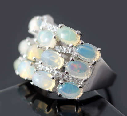 BROAD BAND STERLING SILVER RING SET WITH AAA QUALITY RAINBOW WHITE OPALS.