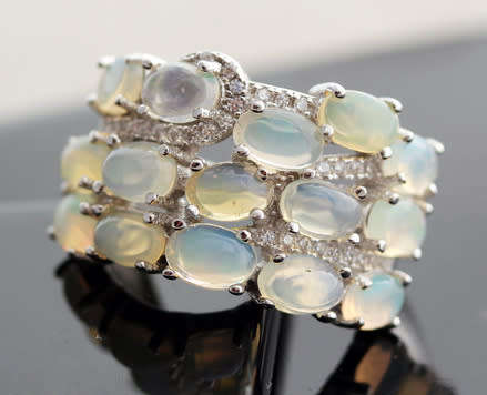BROAD BAND STERLING SILVER RING SET WITH AAA QUALITY RAINBOW WHITE OPALS.