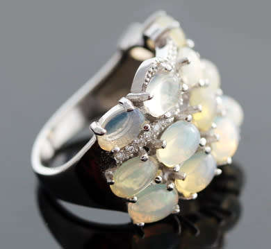 BROAD BAND STERLING SILVER RING SET WITH AAA QUALITY RAINBOW WHITE OPALS.