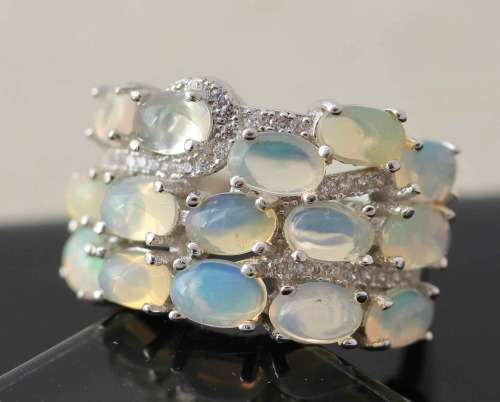 BROAD BAND STERLING SILVER RING SET WITH AAA QUALITY RAINBOW WHITE OPALS.