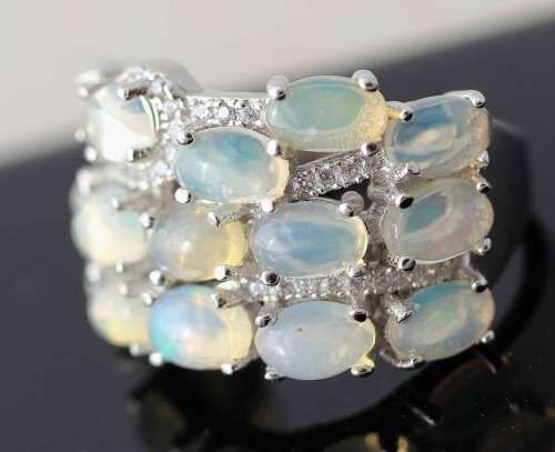 BROAD BAND STERLING SILVER RING SET WITH AAA QUALITY RAINBOW WHITE OPALS.