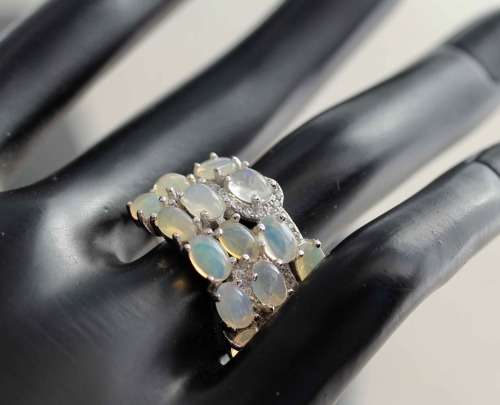 BROAD BAND STERLING SILVER RING SET WITH AAA QUALITY RAINBOW WHITE OPALS.