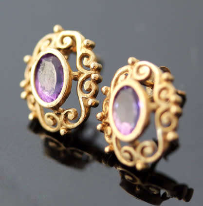 VINTAGE 9CT YELLOW GOLD FILIGREE STUD EARRINGS WITH OVAL FACETED AMETHYSTS. 375