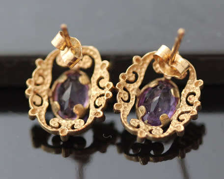 VINTAGE 9CT YELLOW GOLD FILIGREE STUD EARRINGS WITH OVAL FACETED AMETHYSTS. 375