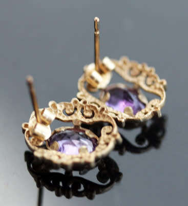 VINTAGE 9CT YELLOW GOLD FILIGREE STUD EARRINGS WITH OVAL FACETED AMETHYSTS. 375