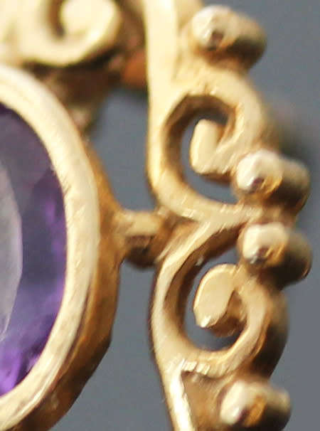 VINTAGE 9CT YELLOW GOLD FILIGREE STUD EARRINGS WITH OVAL FACETED AMETHYSTS. 375