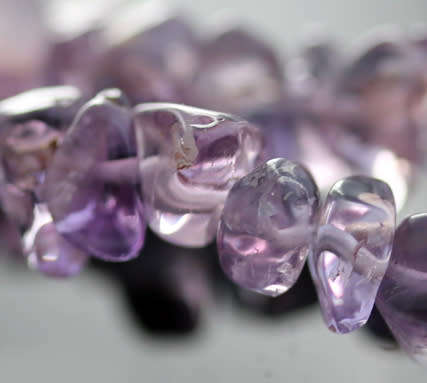 POLISHED NATURAL AMETHYST AND STERLING SILVER BEAD NECKLACE WITH BLACK BAROQUE PEARL PENDANT