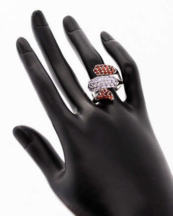 DRAMATIC TRIPLE CROSSOVER STERLING SILVER RING WITH BLUE TANZANITE AND MOZAMBICAN GARNETS. 925