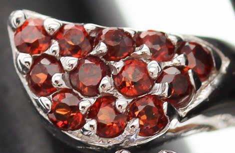 DRAMATIC TRIPLE CROSSOVER STERLING SILVER RING WITH BLUE TANZANITE AND MOZAMBICAN GARNETS. 925