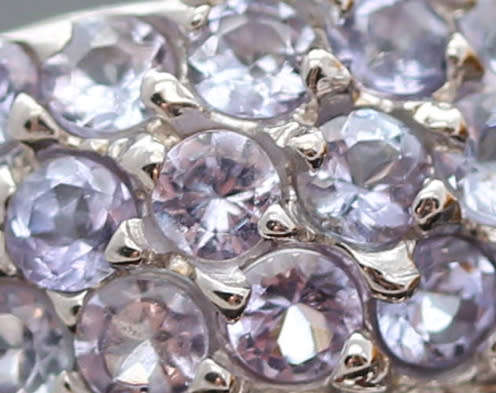 DRAMATIC TRIPLE CROSSOVER STERLING SILVER RING WITH BLUE TANZANITE AND MOZAMBICAN GARNETS. 925