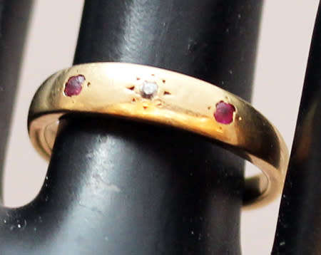 ANTIQUE ENGLISH 9CT GOLD BAND GYPSY SET RUBY AND STAR SET DIAMOND RING. circa early 1900's