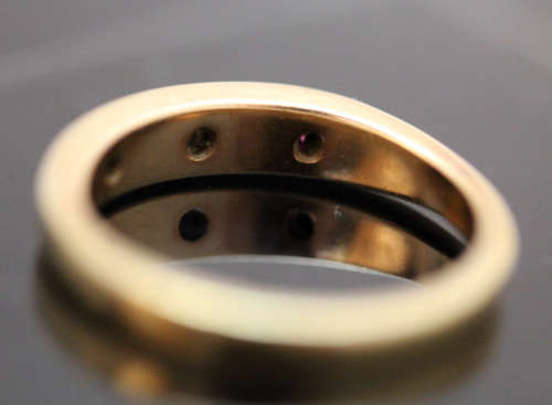 ANTIQUE ENGLISH 9CT GOLD BAND GYPSY SET RUBY AND STAR SET DIAMOND RING. circa early 1900's