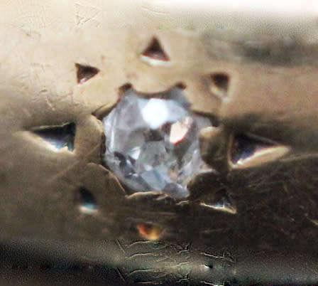 ANTIQUE ENGLISH 9CT GOLD BAND GYPSY SET RUBY AND STAR SET DIAMOND RING. circa early 1900's