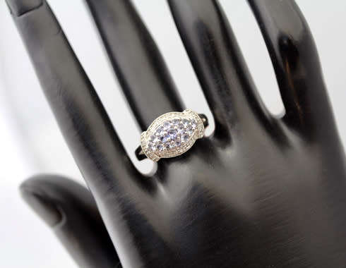 TANZANITE AND DIAMOND STERLING SILVER RING. 925