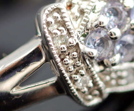 TANZANITE AND DIAMOND STERLING SILVER RING. 925