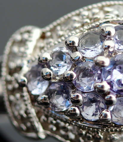 TANZANITE AND DIAMOND STERLING SILVER RING. 925