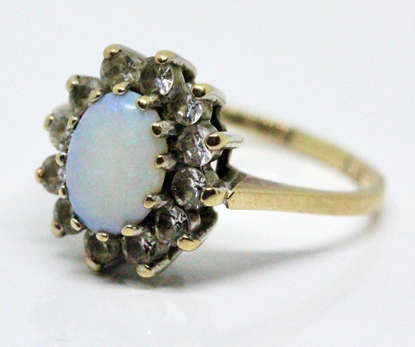 OPAL VINTAGE 9CT YELLOW AND WHITE GOLD RING WITH WHITE STONE ACCENTS. 375