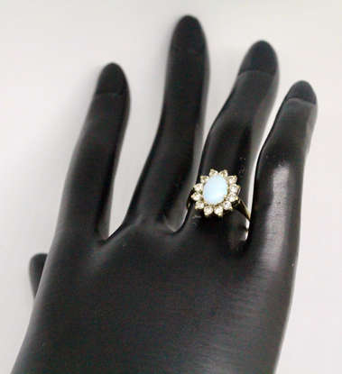 OPAL VINTAGE 9CT YELLOW AND WHITE GOLD RING WITH WHITE STONE ACCENTS. 375