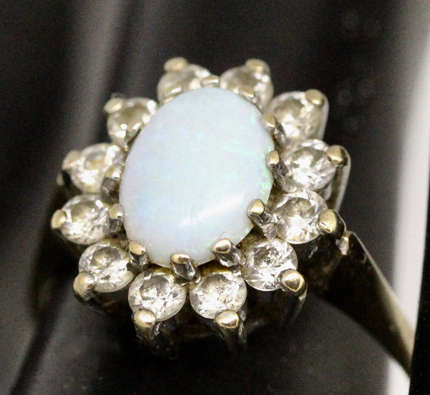 OPAL VINTAGE 9CT YELLOW AND WHITE GOLD RING WITH WHITE STONE ACCENTS. 375
