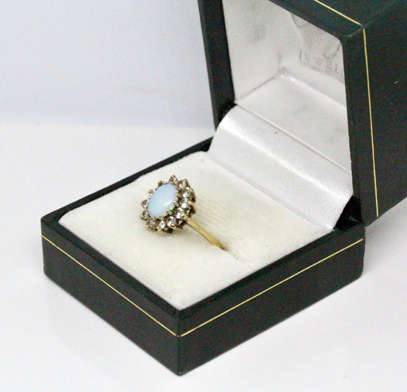 OPAL VINTAGE 9CT YELLOW AND WHITE GOLD RING WITH WHITE STONE ACCENTS. 375