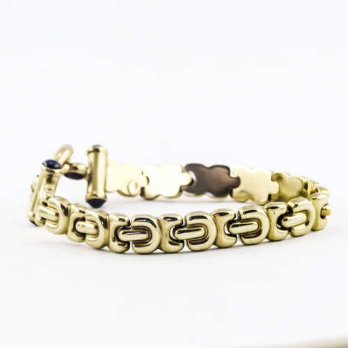 VINTAGE 9CT YELLOW GOLD GATE BRACELET WITH `SINORETTI` CLASP and ONYX. JEWELLER EVALUATION R20`000