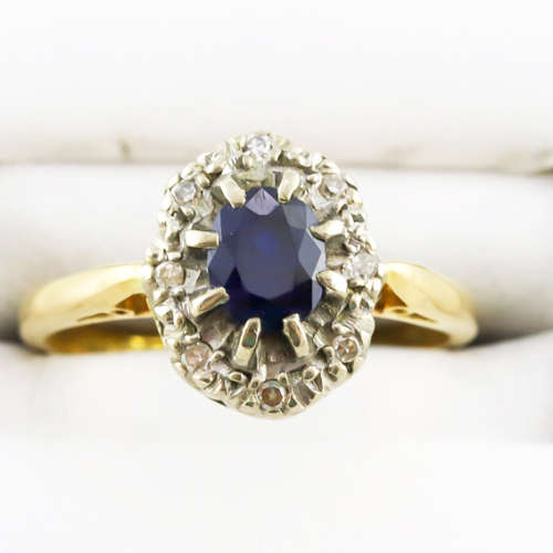 STRIKING VINTAGE DEEP BLUE SAPPHIRE AND DIAMOND 18CT YELLOW AND WHITE GOLD RING. INCL CERT R16`500