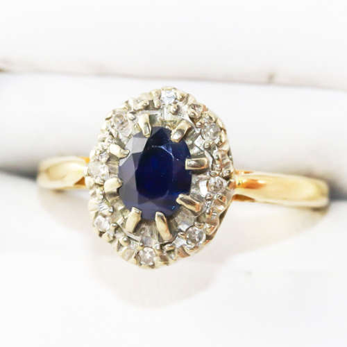 STRIKING VINTAGE DEEP BLUE SAPPHIRE AND DIAMOND 18CT YELLOW AND WHITE GOLD RING. INCL CERT R16`500