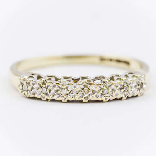 SLENDER DIAMOND HALF ETERNITY 9CT YELLOW AND WHITE GOLD RING. 375. `ILLUSION` SETTING