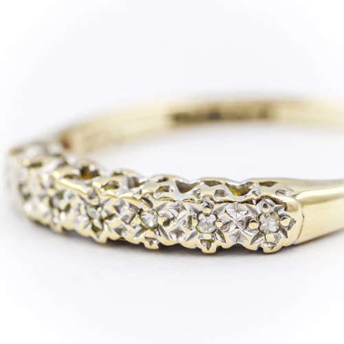 SLENDER DIAMOND HALF ETERNITY 9CT YELLOW AND WHITE GOLD RING. 375. `ILLUSION` SETTING