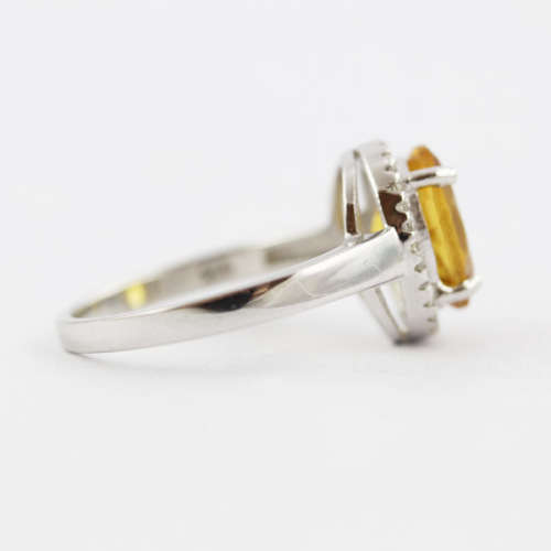 CONTEMPORARY DESIGN STERLING SILVER RING - OVAL CITRINE SOLITAIRE WITH CUBIC ZIRCONIA HALO. 925