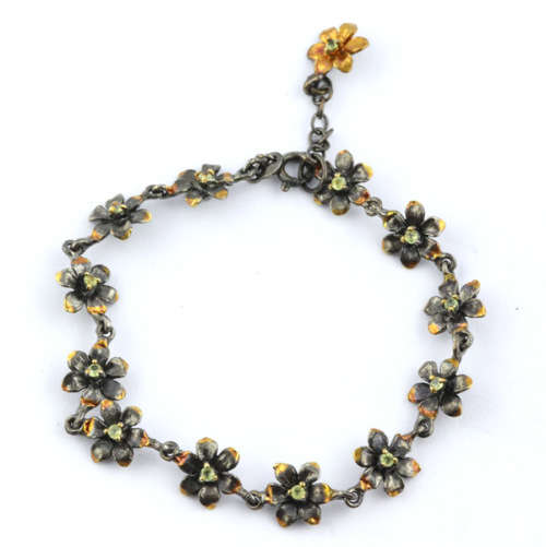DAINTY FLORAL BRACELET IN GUNMETAL STERLING SILVER WITH PERIDOT CENTRES AND ROSE GOLD-HUED ACCENTS