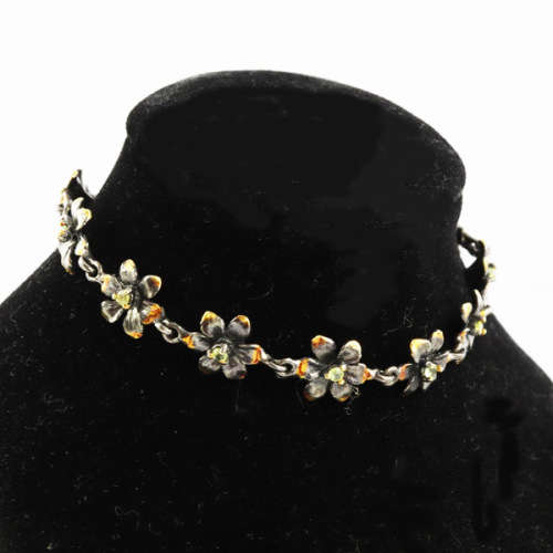 DAINTY FLORAL BRACELET IN GUNMETAL STERLING SILVER WITH PERIDOT CENTRES AND ROSE GOLD-HUED ACCENTS