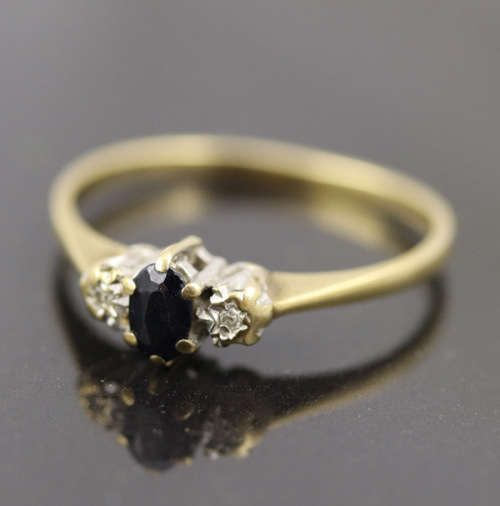 DAINTY OVAL SAPPHIRE AND DIAMOND 9CT YELLOW AND WHITE GOLD RING. * JEWELLER EVALUATION R12`000 *