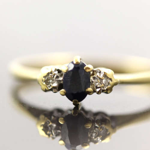 DAINTY OVAL SAPPHIRE AND DIAMOND 9CT YELLOW AND WHITE GOLD RING. * JEWELLER EVALUATION R12`000 *