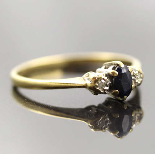 DAINTY OVAL SAPPHIRE AND DIAMOND 9CT YELLOW AND WHITE GOLD RING. * JEWELLER EVALUATION R12`000 *