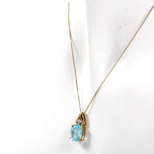 SKY BLUE TOPAZ & DIAMOND PENDANT NECKLACE IN 9CT YELLOW GOLD. *JEWELLER EVAL. CERT. R15`000*